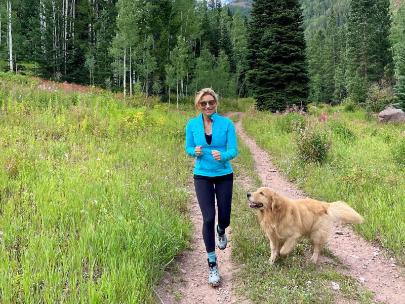 woman on a hike with her dog