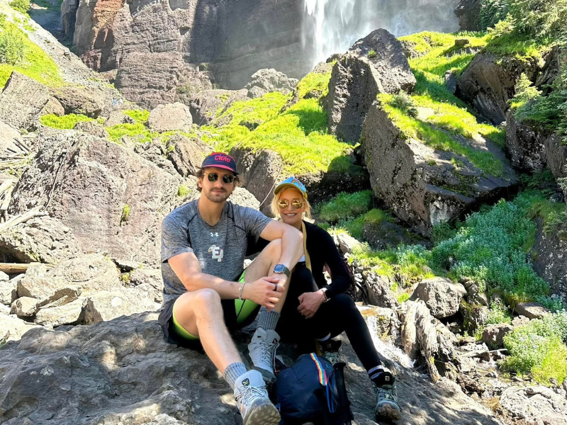 woman on a hike near a waterfall